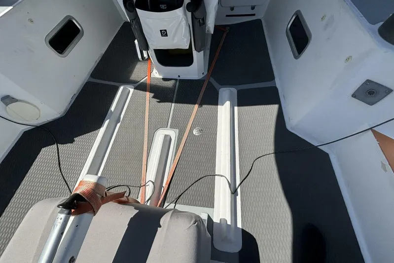 Zed4 Yacht Photos Pics Interior view of 2009 Class 40 Akilaria RC2 sailboat cockpit with seating and equipment.