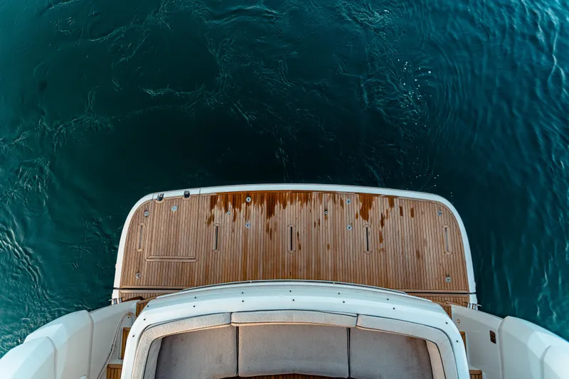 Fat Boy Yacht Photos Pics Azimut Magellano 66 yacht deck, 2020 model, overlooking calm blue water.