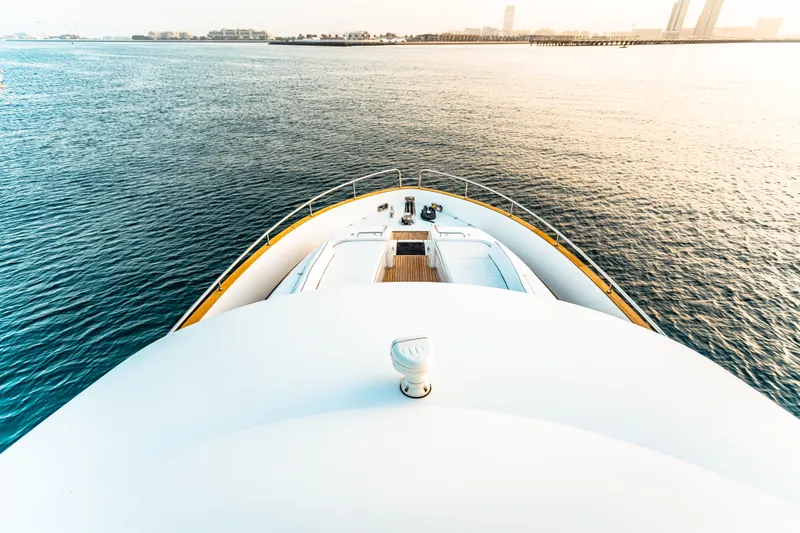Fat Boy Yacht Photos Pics Bow view of 2020 Azimut Magellano 66 yacht on calm waters at sunset.
