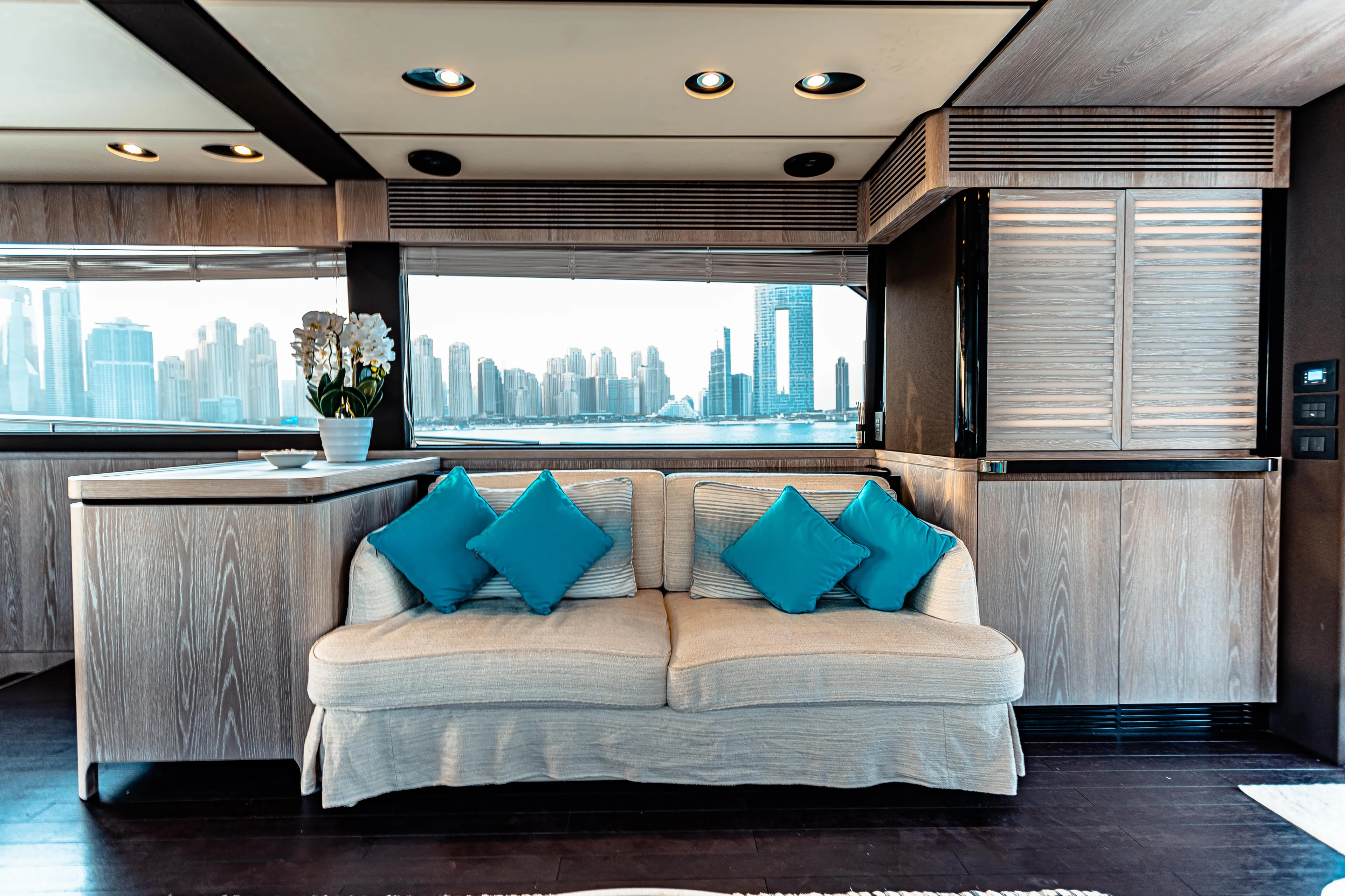 Fat Boy Yacht Photos Pics Luxurious interior of 2020 Azimut Magellano 66 yacht with city skyline view.