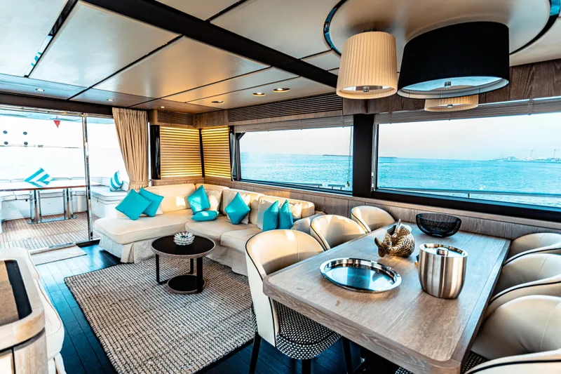 Fat Boy Yacht Photos Pics Luxurious interior of 2020 Azimut Magellano 66 yacht with ocean view and elegant furnishings.
