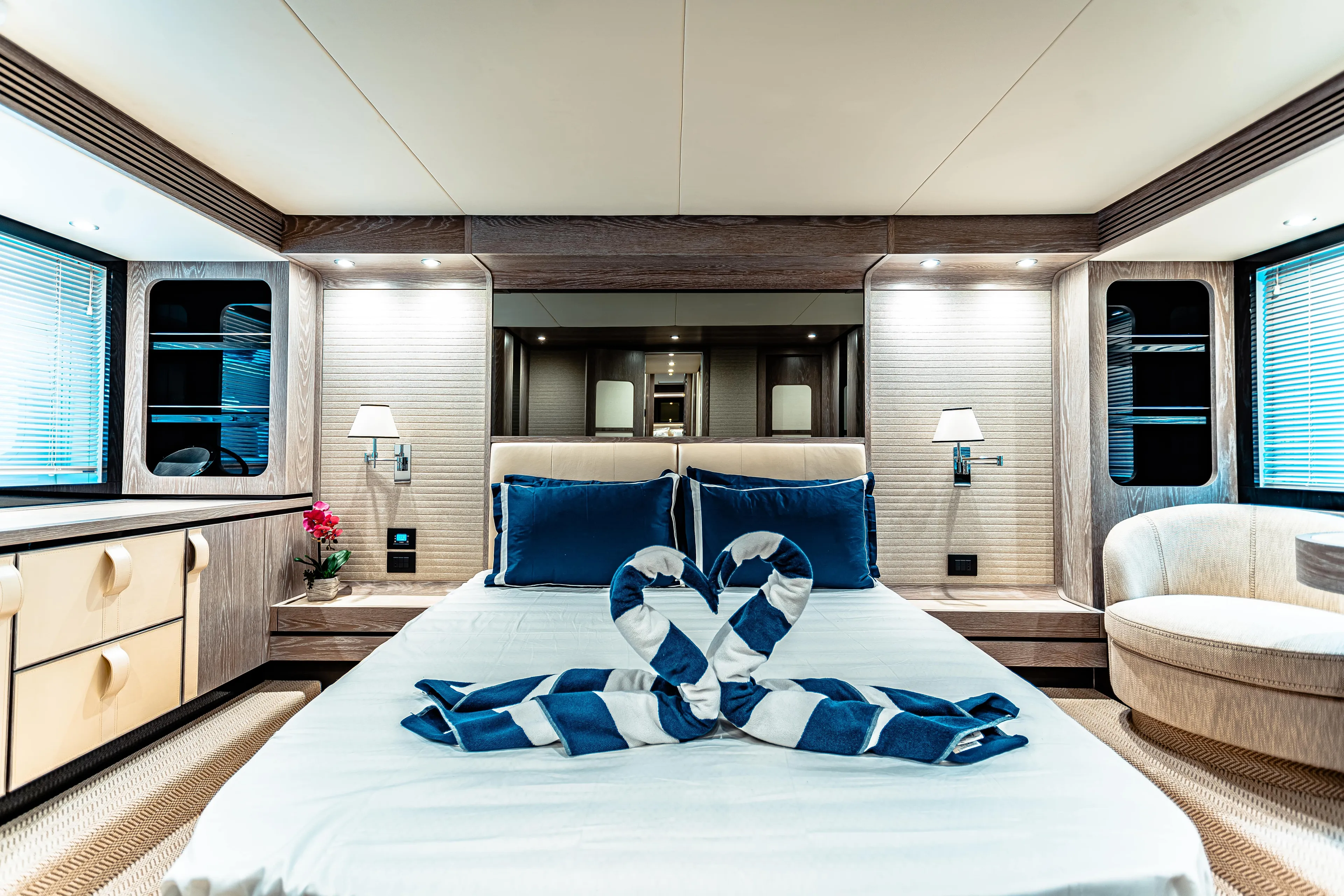 Fat Boy Yacht Photos Pics Luxurious bedroom interior of 2020 Azimut Magellano 66 yacht with elegant decor.
