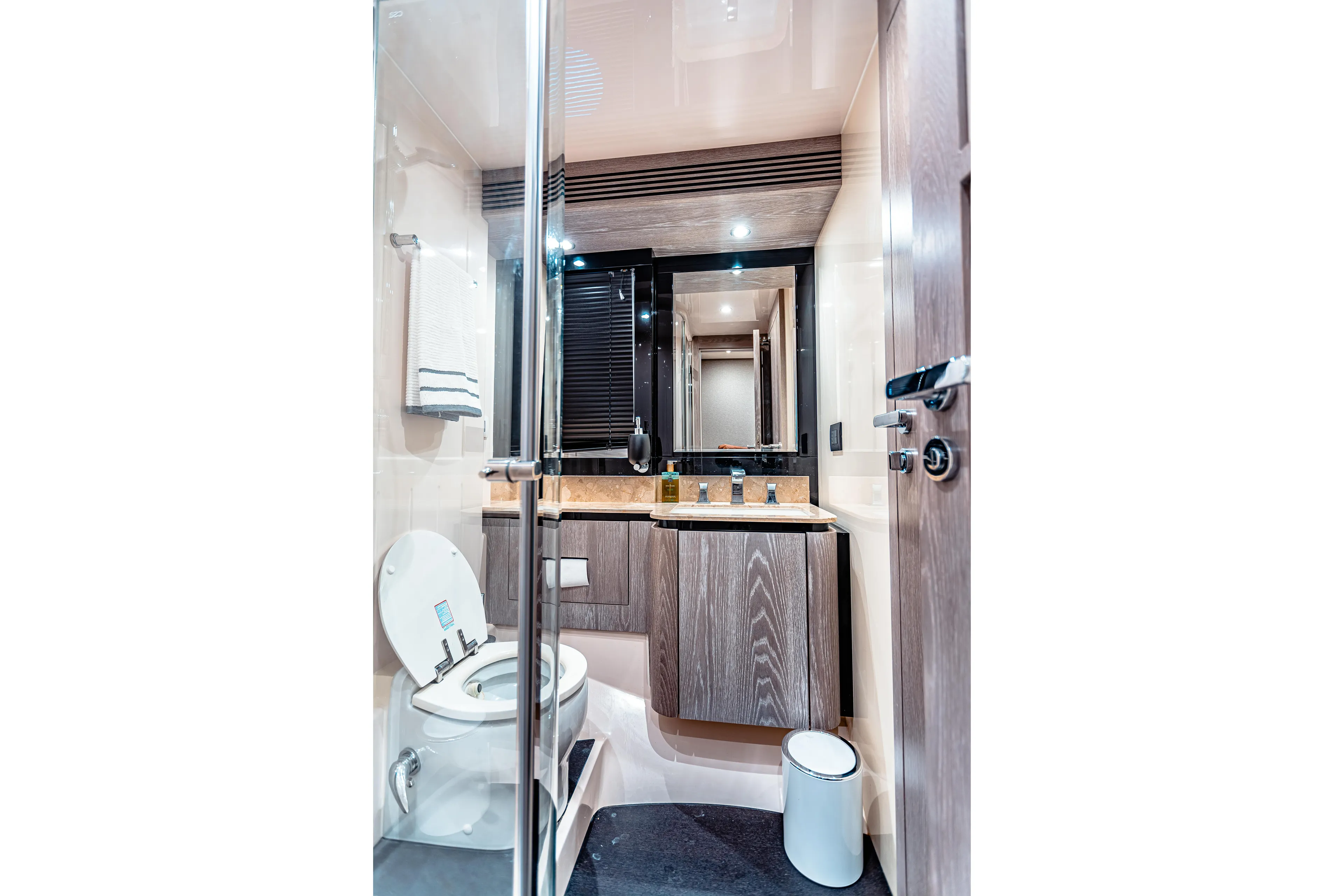 Fat Boy Yacht Photos Pics Luxurious bathroom interior of 2020 Azimut Magellano 66 yacht, featuring modern fixtures and elegant design.