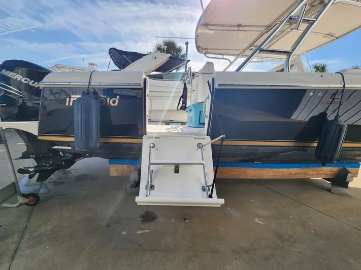  Yacht Photos Pics 2008 Intrepid 323 Cuddy boat with Mercury engines, docked and ready for adventure.