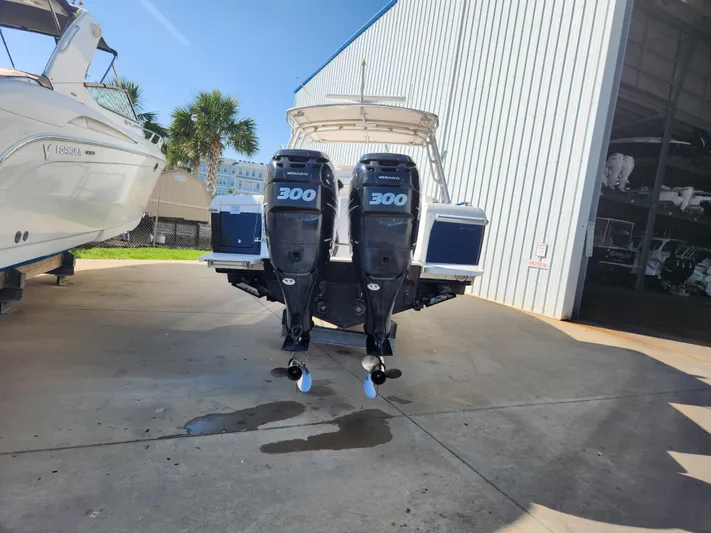  Yacht Photos Pics 2008 Intrepid 323 Cuddy with dual 300 horsepower engines in a marina setting.