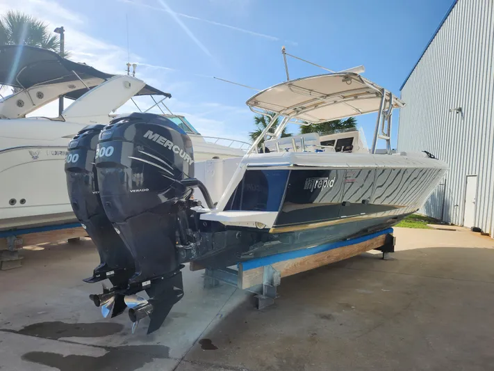  Yacht Photos Pics 2008 Intrepid 323 Cuddy boat with twin Mercury 300 engines on display.