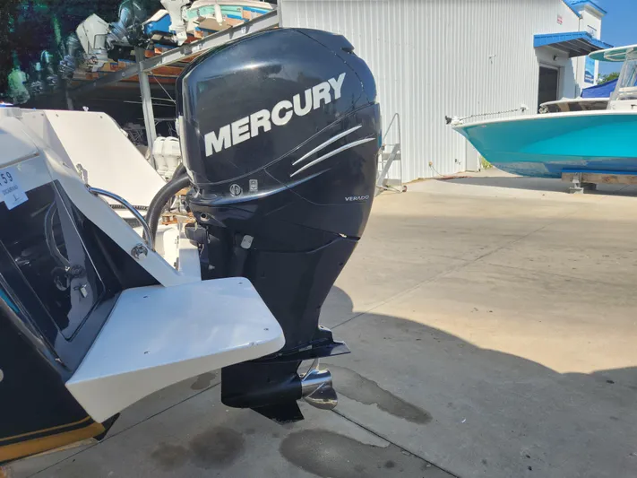  Yacht Photos Pics 2008 Intrepid 323 Cuddy with Mercury Verado outboard motor in a marina setting.