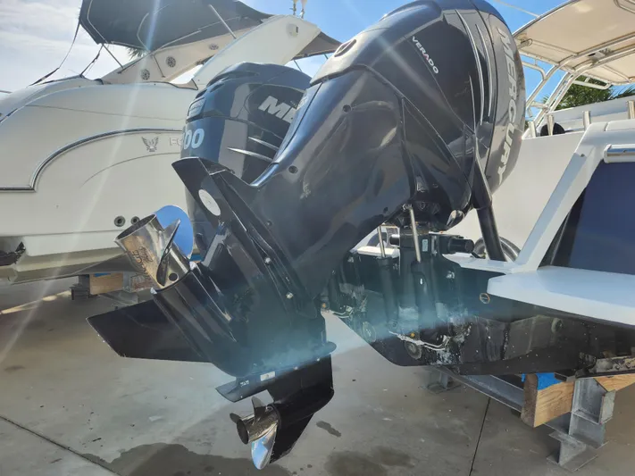  Yacht Photos Pics 2008 Intrepid 323 Cuddy with Mercury Verado outboard engines, docked in a marina.