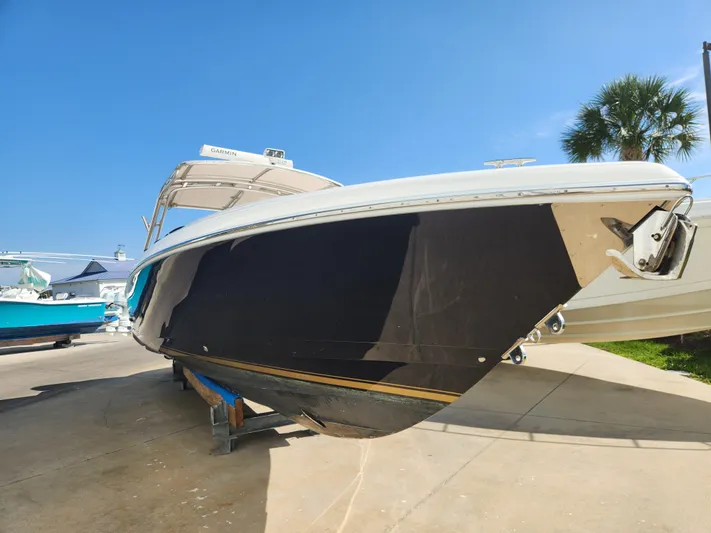  Yacht Photos Pics 2008 Intrepid 323 Cuddy boat on display, featuring sleek design and Garmin equipment.