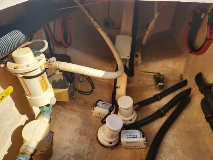  Yacht Photos Pics Bilge area of 2008 Intrepid 323 Cuddy with pumps and hoses visible.