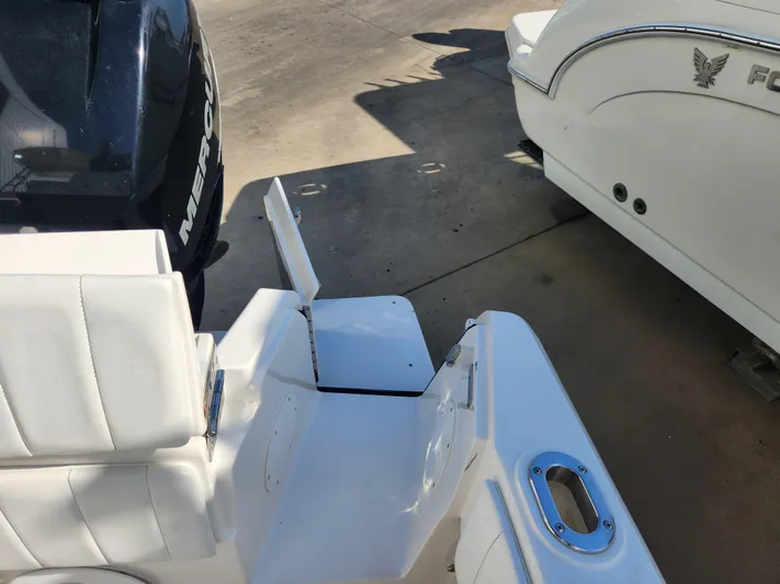  Yacht Photos Pics 2008 Intrepid 323 Cuddy boat with Mercury engine, featuring white seating and deck details.