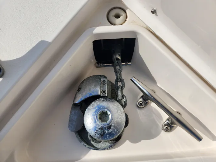  Yacht Photos Pics Anchor chain and cleat on 2008 Intrepid 323 Cuddy boat deck.