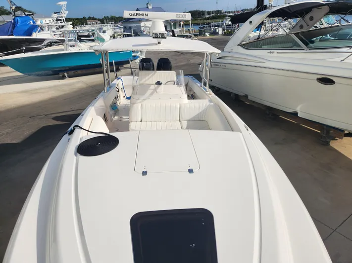  Yacht Photos Pics 2008 Intrepid 323 Cuddy boat docked, featuring spacious seating and modern design.