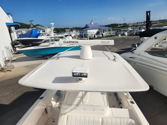  Yacht Photos Pics 2008 Intrepid 323 Cuddy boat with Garmin radar, docked at a marina.