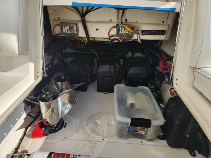  Yacht Photos Pics 2008 Intrepid 323 Cuddy engine compartment with batteries, wiring, and propellers.