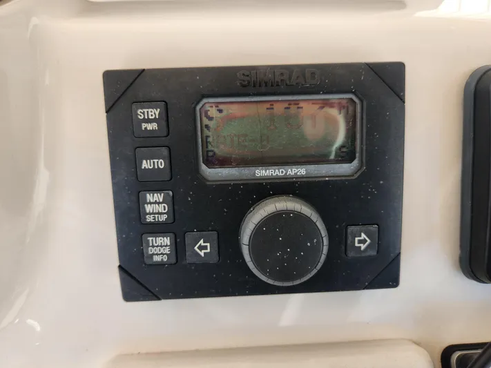  Yacht Photos Pics Simrad AP26 autopilot control on 2008 Intrepid 323 Cuddy boat dashboard.