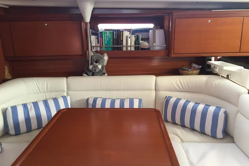Perseverance Yacht Photos Pics Interior of 2012 Grand Soleil 43 yacht with cozy seating and striped cushions.