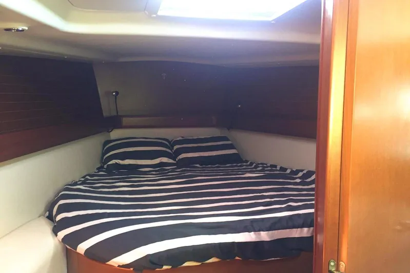 Perseverance Yacht Photos Pics Cozy cabin interior of 2012 Grand Soleil 43 yacht with striped bedding.