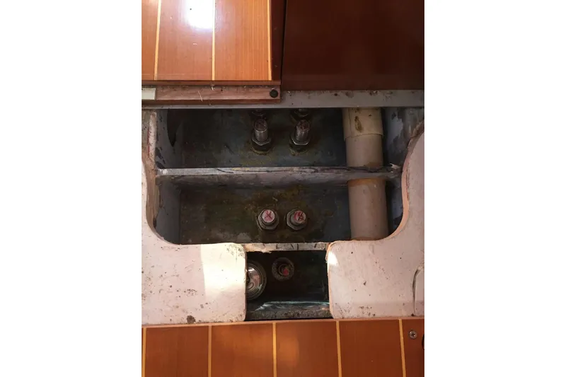 Perseverance Yacht Photos Pics Interior view of 2012 Grand Soleil 43 yacht's bilge area with visible pipes and bolts.