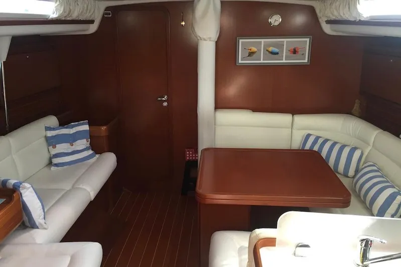 Perseverance Yacht Photos Pics Interior of 2012 Grand Soleil 43 yacht with cozy seating and striped cushions.