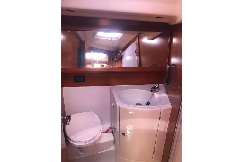 Perseverance Yacht Photos Pics Bathroom interior of 2012 Grand Soleil 43 yacht with sink and toilet.
