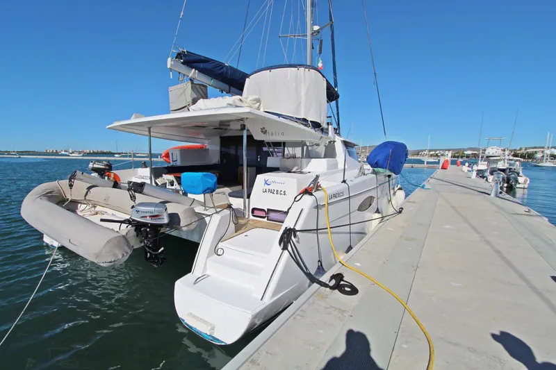  Yacht Photos Pics 2013 Fountaine Pajot Helia 44 catamaran docked at marina, rear view.