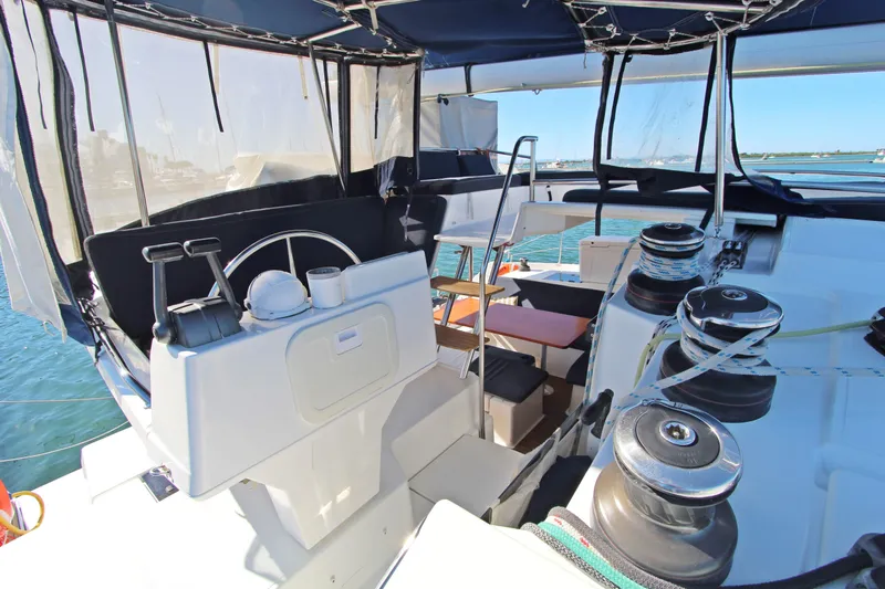 Yacht Photos Pics Helm station of 2013 Fountaine Pajot Helia 44 catamaran with winches and seating.