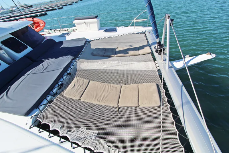  Yacht Photos Pics Fountaine Pajot Helia 44 catamaran deck with netting and cushions, 2013 model.