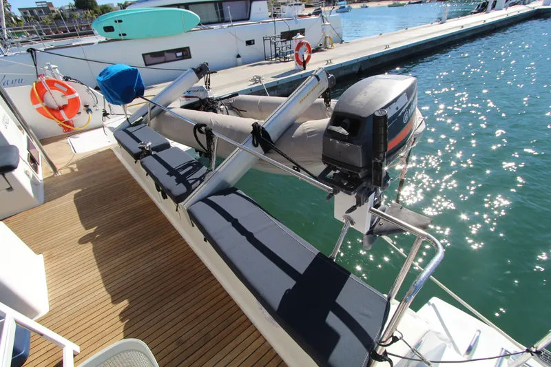  Yacht Photos Pics 2013 Fountaine Pajot Helia 44 catamaran deck with outboard motor and dinghy.