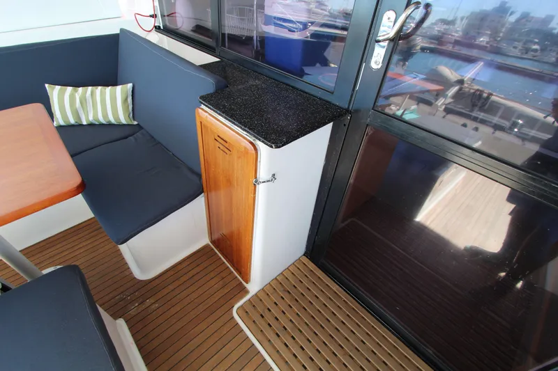  Yacht Photos Pics Interior of 2013 Fountaine Pajot Helia 44 catamaran with seating and table.