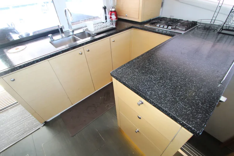  Yacht Photos Pics Modern kitchen in 2013 Fountaine Pajot Helia 44 yacht with sleek countertops and cabinetry.