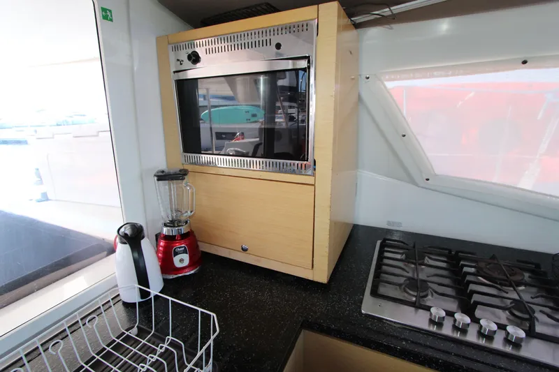  Yacht Photos Pics Modern kitchen in 2013 Fountaine Pajot Helia 44 yacht with appliances and gas stove.