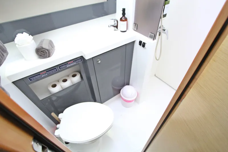  Yacht Photos Pics Bathroom interior of 2013 Fountaine Pajot Helia 44 catamaran, featuring modern amenities.