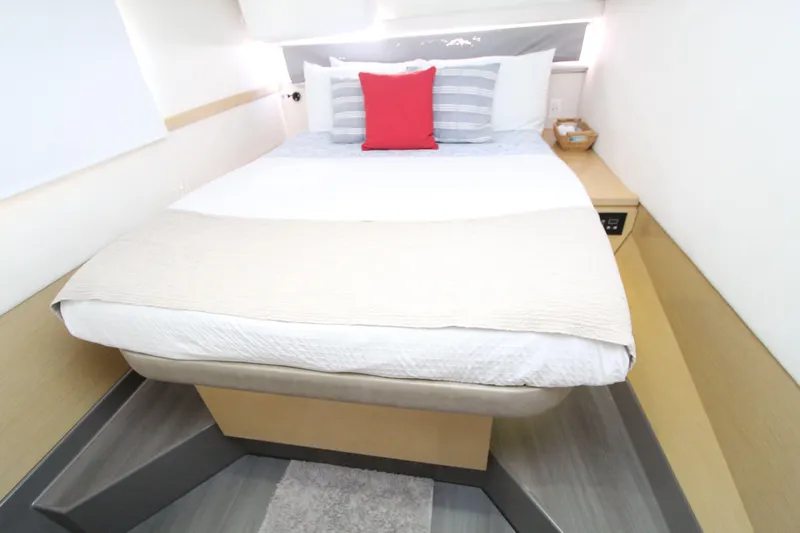  Yacht Photos Pics Luxurious bedroom interior of 2013 Fountaine Pajot Helia 44 catamaran with modern bedding.