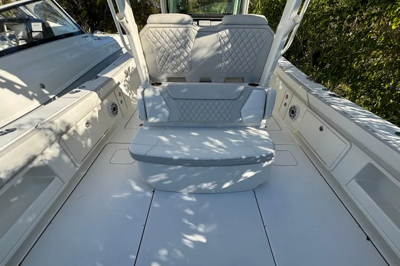 Wcn 57599 325cc Yacht Photos Pics 2025 World Cat 325 CC boat interior with cushioned seating and sleek design.