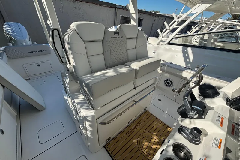 Wcn 57599 325cc Yacht Photos Pics 2025 World Cat 325 CC boat interior with luxurious seating and modern helm controls.