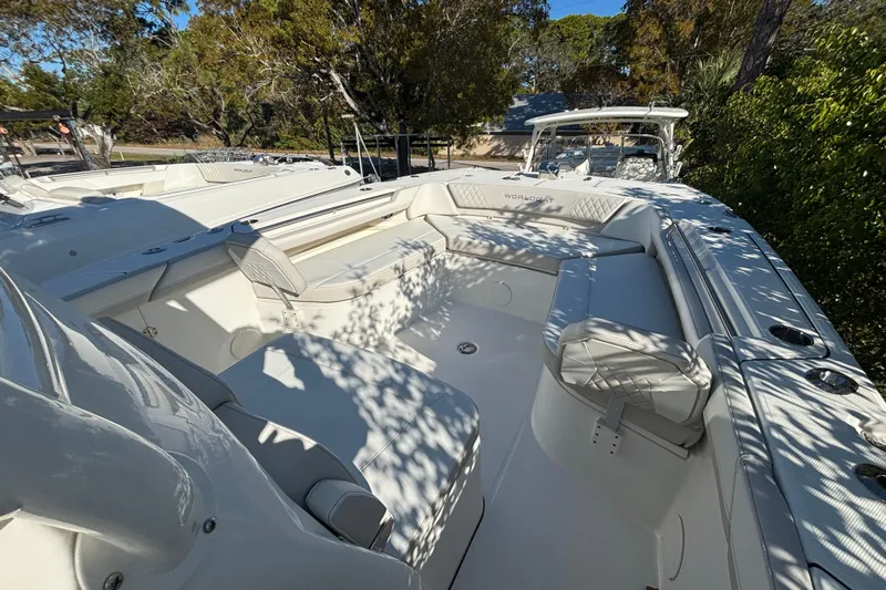 Wcn 57599 325cc Yacht Photos Pics 2025 World Cat 325 CC boat with spacious seating and sleek design in a natural setting.