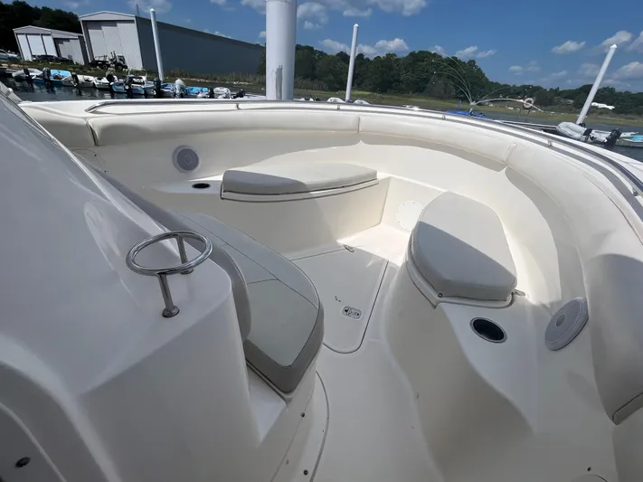  Yacht Photos Pics 2011 Pursuit S 280 Sport boat interior with cushioned seating and cup holders.