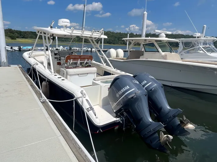  Yacht Photos Pics 2011 Pursuit S 280 Sport boat docked with twin Yamaha engines.