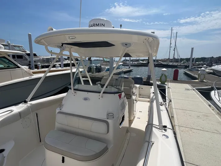  Yacht Photos Pics 2011 Pursuit S 280 Sport boat docked at marina under clear sky.