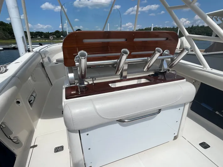  Yacht Photos Pics 2011 Pursuit S 280 Sport boat interior with rod holders and seating.
