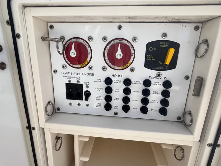  Yacht Photos Pics Control panel of a 2011 Pursuit S 280 Sport boat, featuring engine and windlass switches.