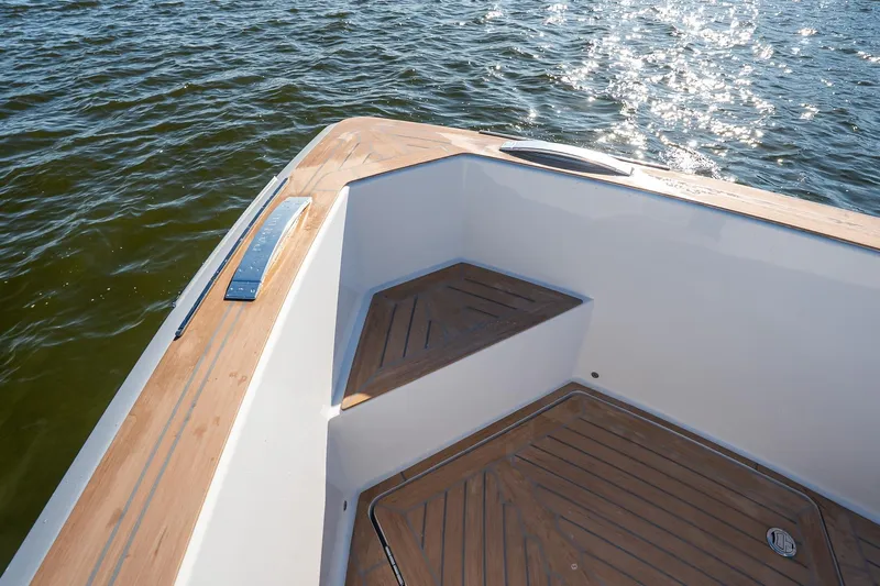 Available Now Yacht Photos Pics 2025 Pardo Yachts 38, elegant deck design with teak accents, on sparkling water.