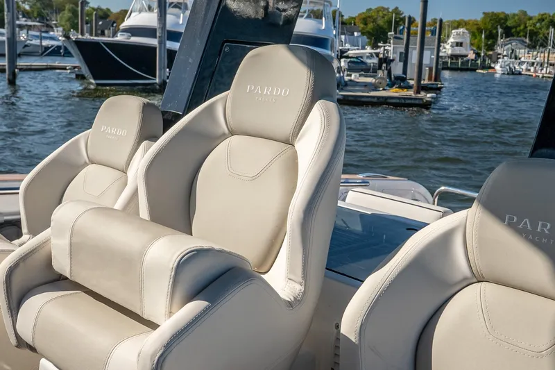 Available Now Yacht Photos Pics Luxurious seating on 2025 Pardo Yachts 38, docked at a marina.