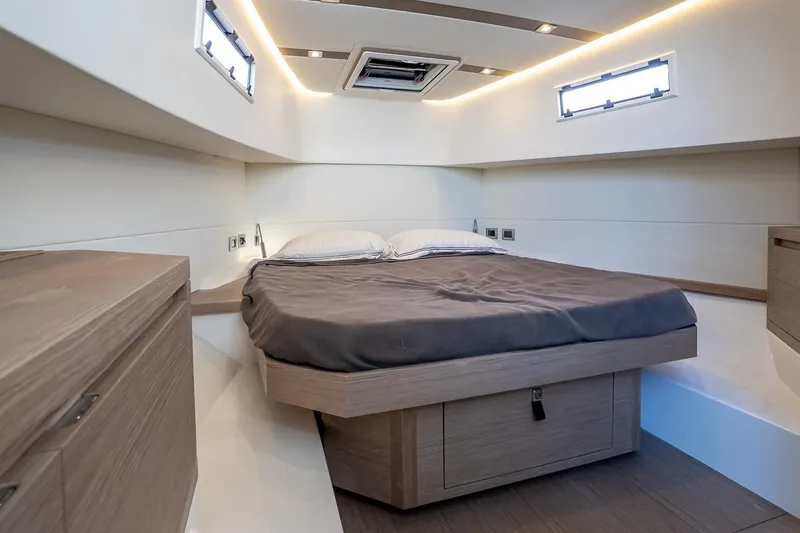 Available Now Yacht Photos Pics Luxurious cabin interior of 2025 Pardo Yachts 38, featuring modern design and cozy bedding.