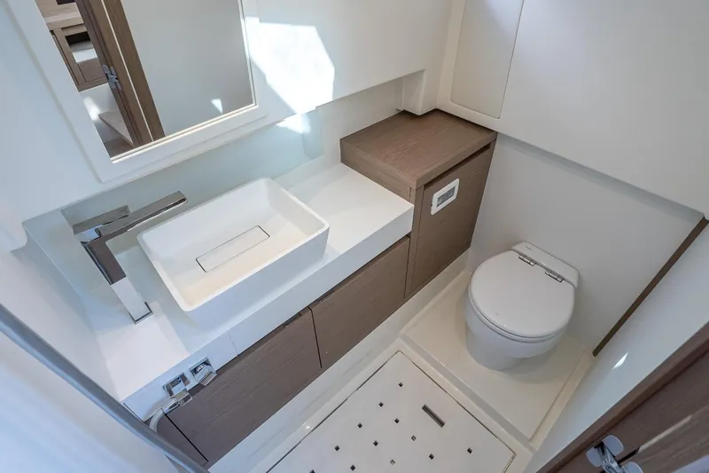 Available Now Yacht Photos Pics Luxurious bathroom in 2025 Pardo Yachts 38, featuring modern sink and toilet.