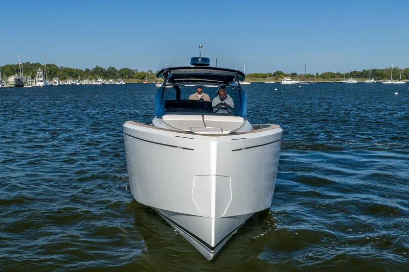 Available Now Yacht Photos Pics 2025 Pardo Yachts 38 cruising on a serene lake under clear blue skies.
