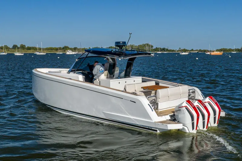 Available Now Yacht Photos Pics 2025 Pardo Yachts 38 cruising on a sunny day with triple outboard engines.