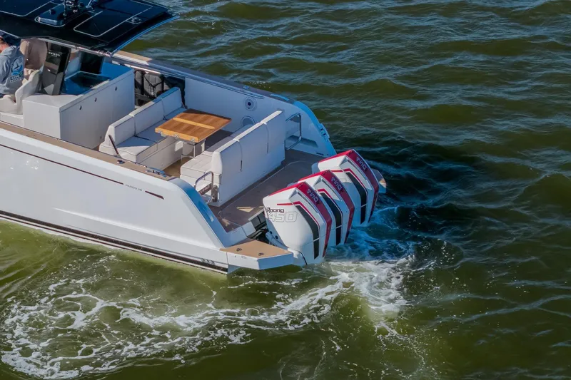 Available Now Yacht Photos Pics 2025 Pardo Yachts 38 with triple outboard engines cruising on water.