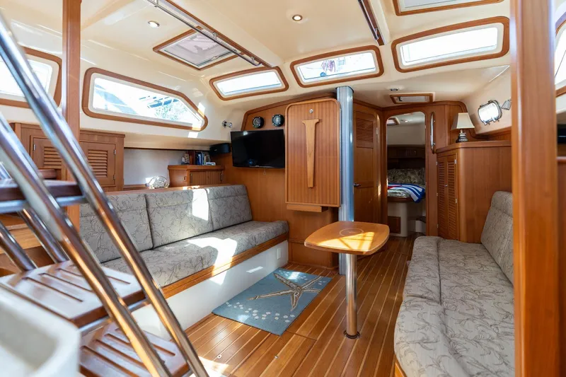 Easy Going Yacht Photos Pics Luxurious interior of 2008 Island Packet 465 yacht with elegant wood finish and comfortable seating.
